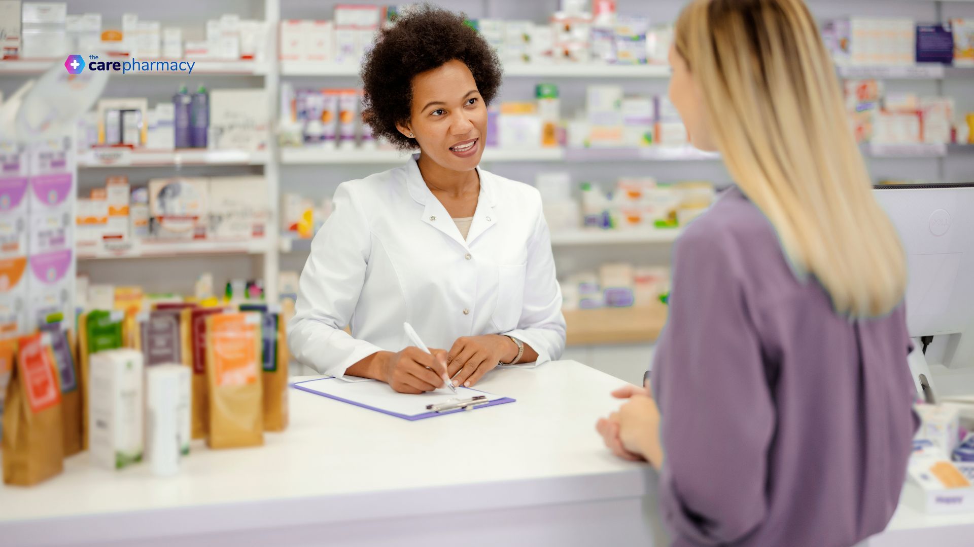 Pharmacists and patient at the counter