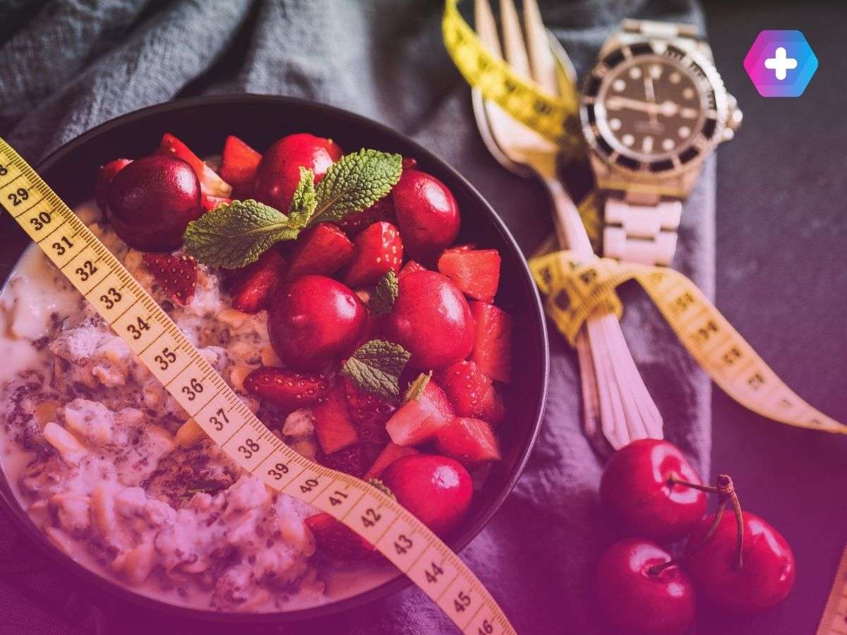 healthy food in bowl next to measuring tape