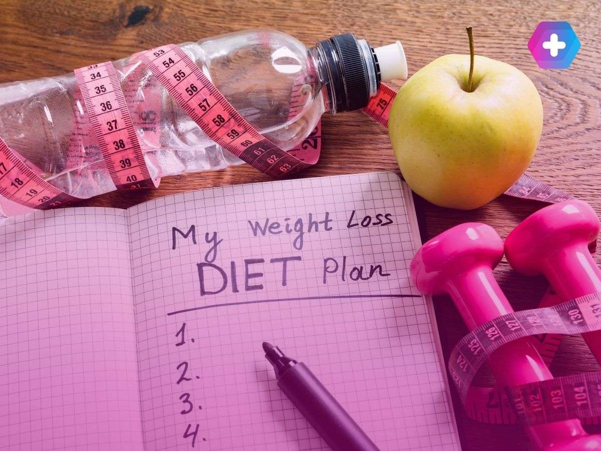 notebook with "my weight loss diet plan" written in it
