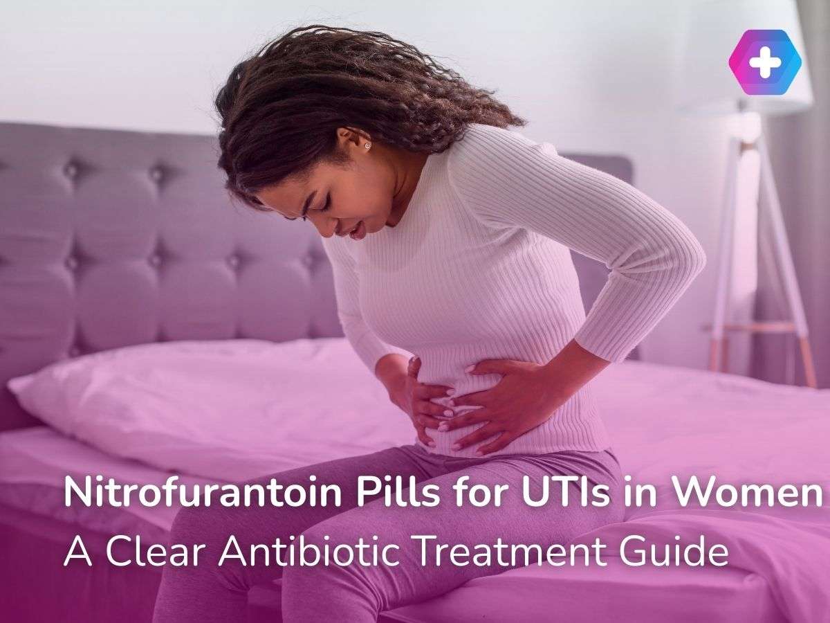 woman clutching lower stomach on bed