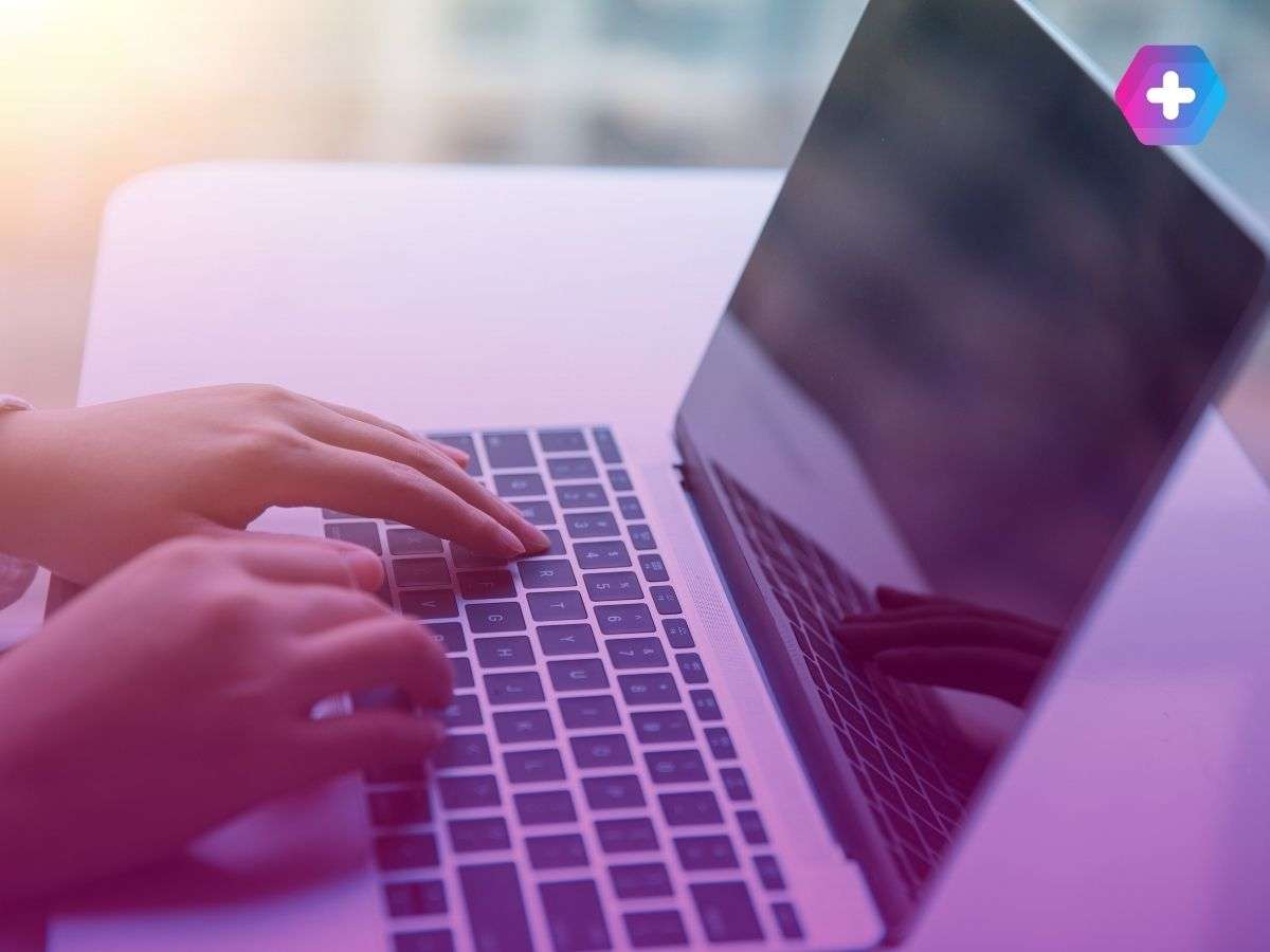 person typing on laptop