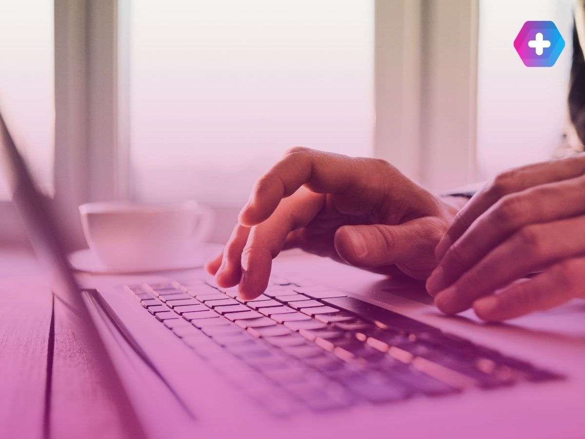 person typing on laptop