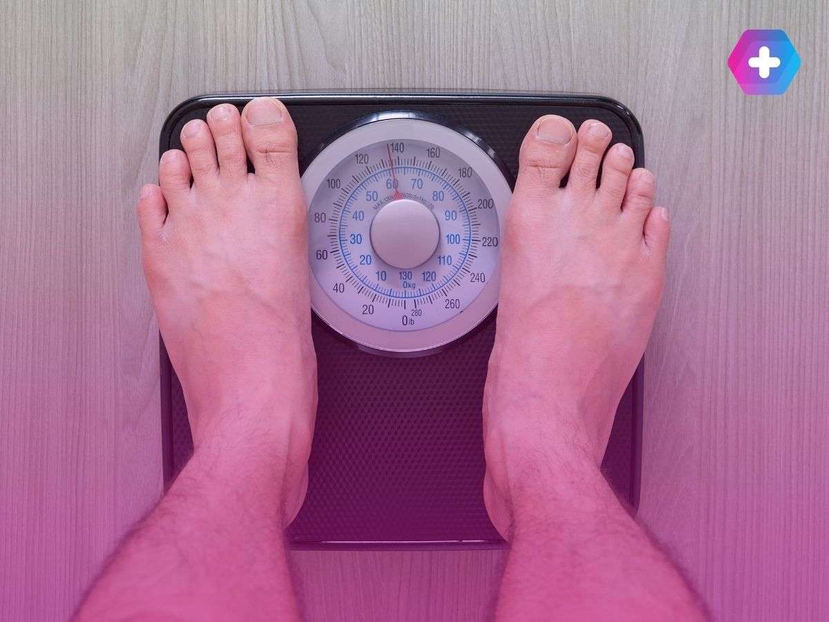 person standing on scales in bare feet
