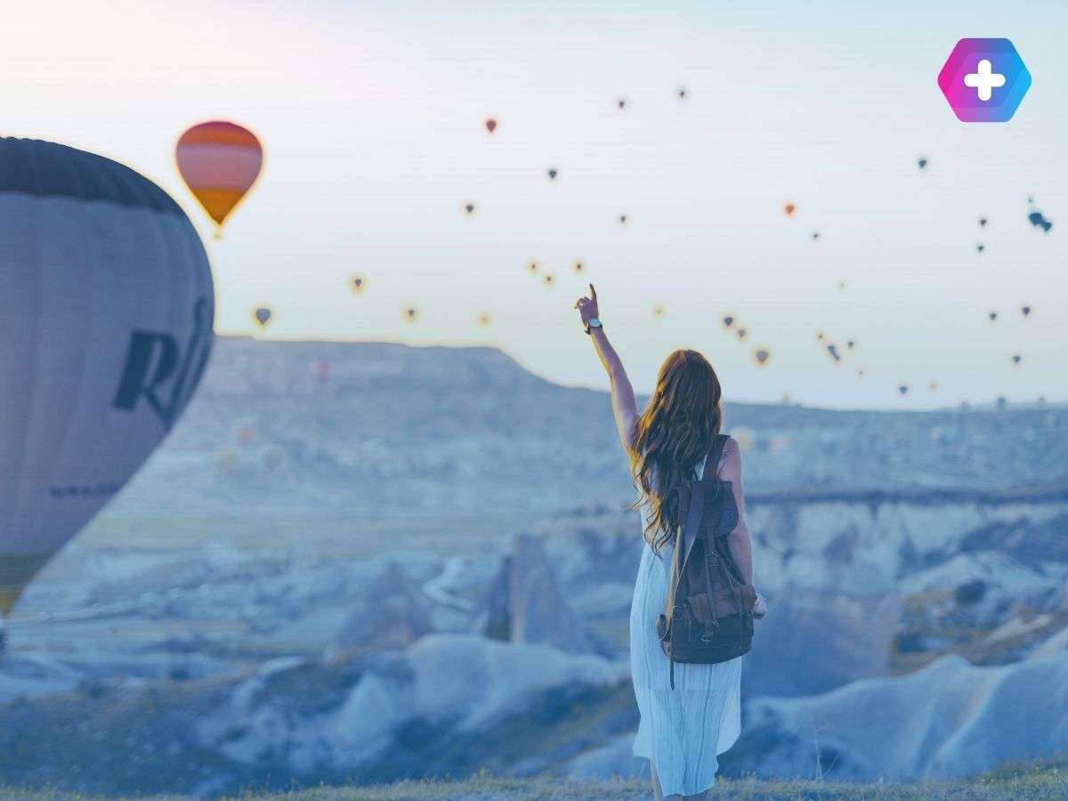 A woman happily travelling on period delay tablets