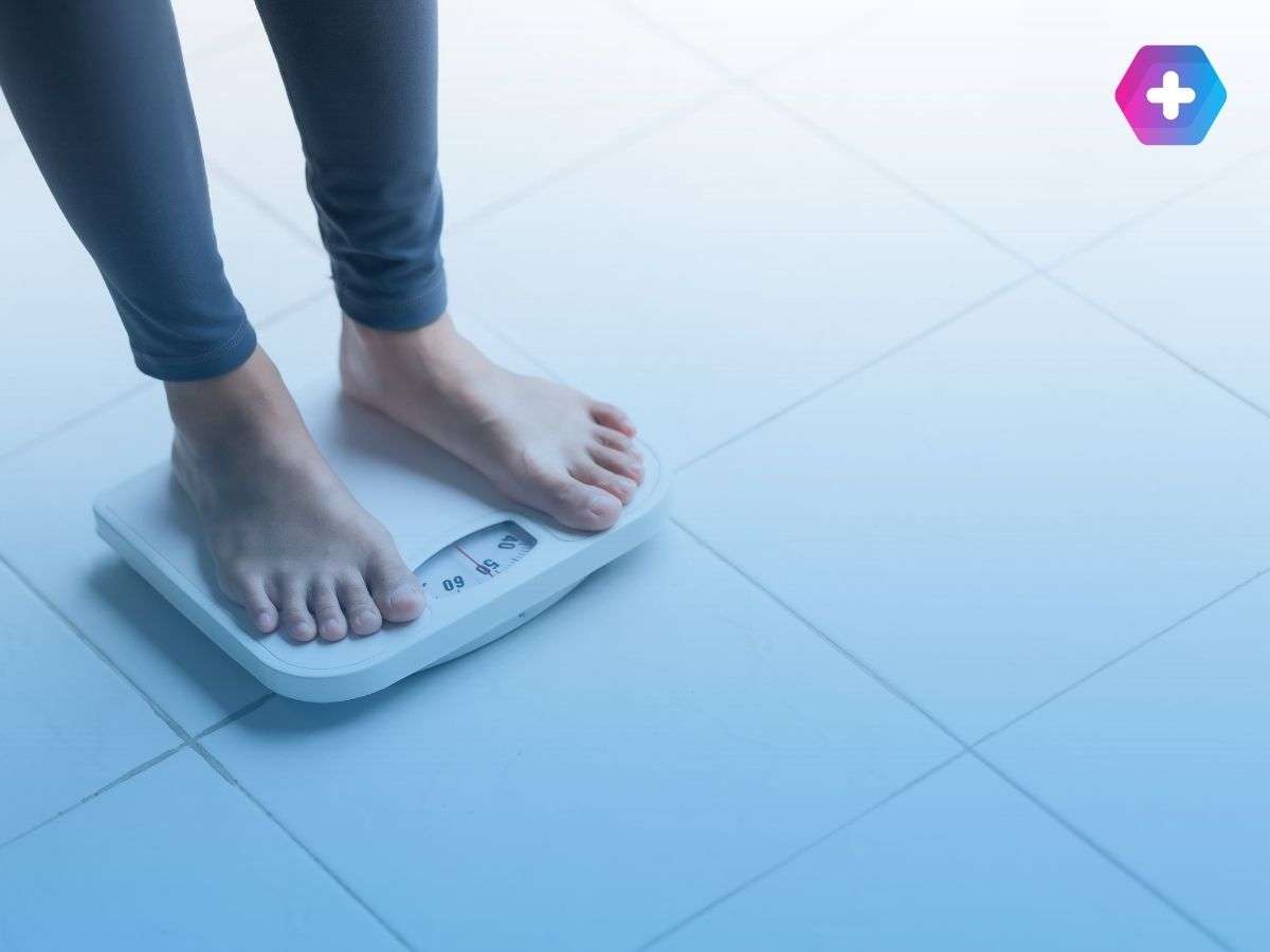 Woman standing on scales