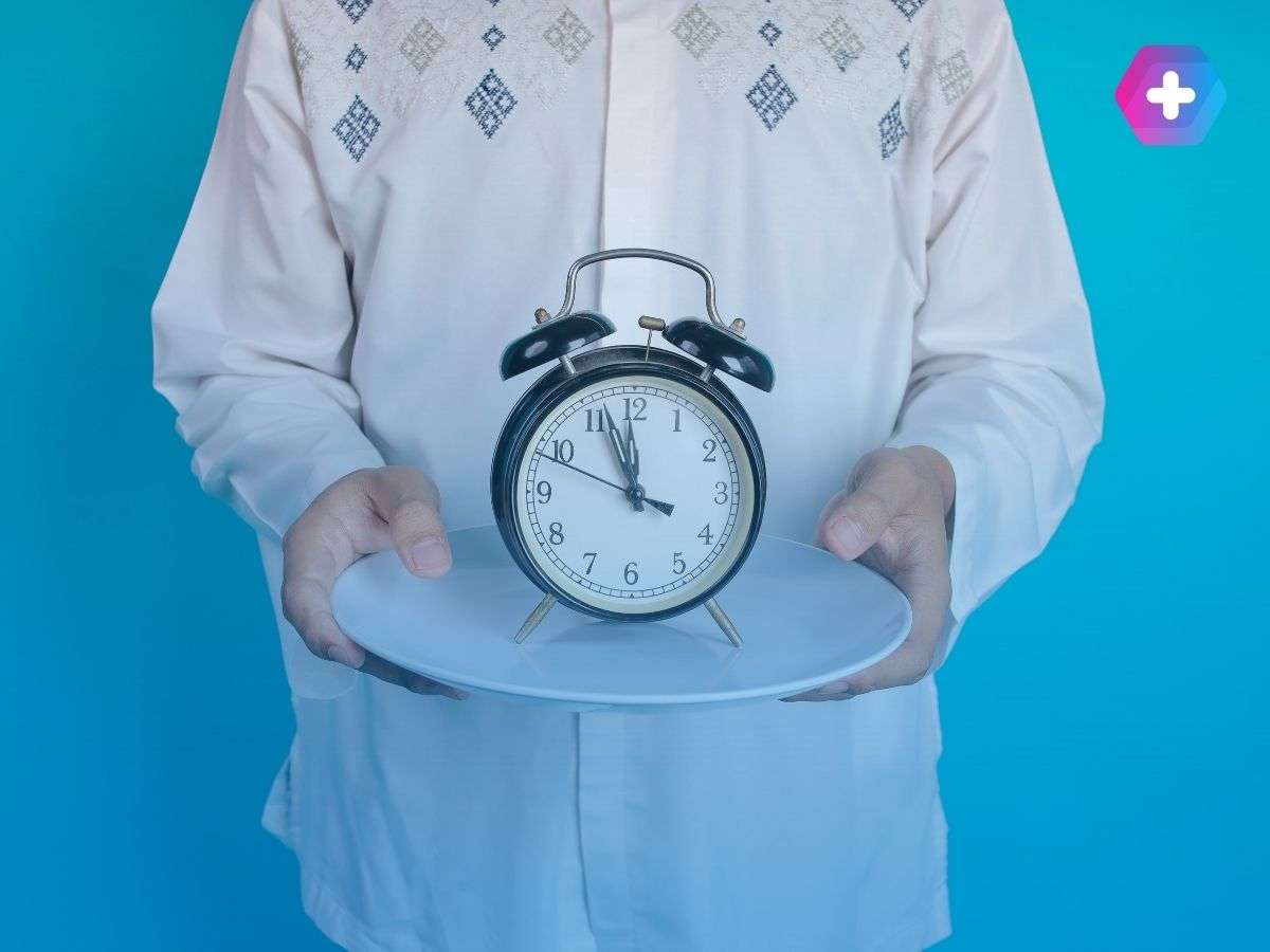 Man holding a clock on a plate to illustrate long NHS weight loss waiting times