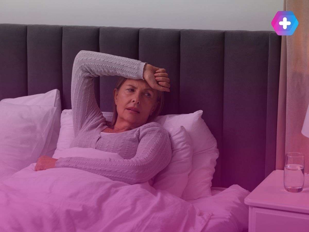 woman lying in bed with hot flushes