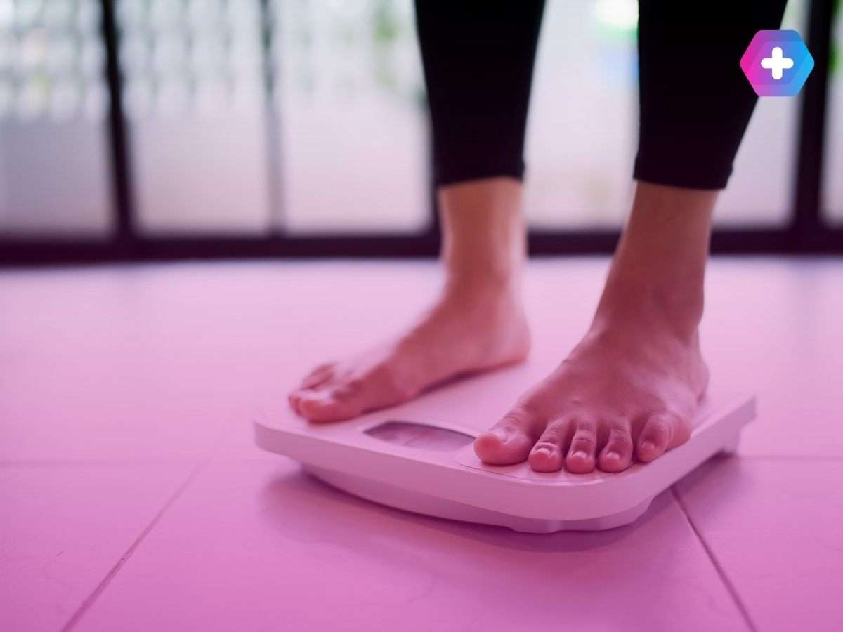 person in bare feet standing on scales