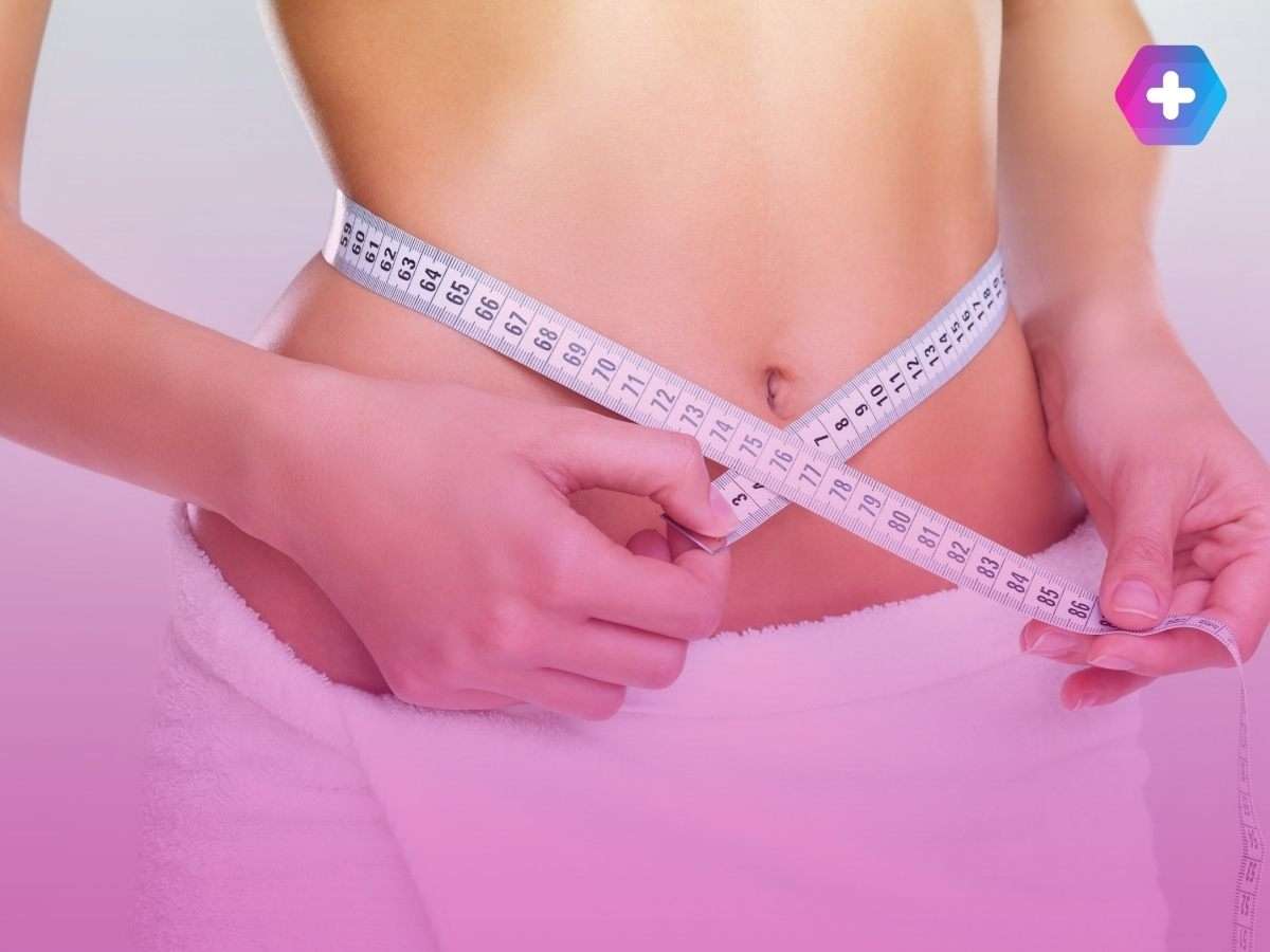 person wearing towel measuring waist