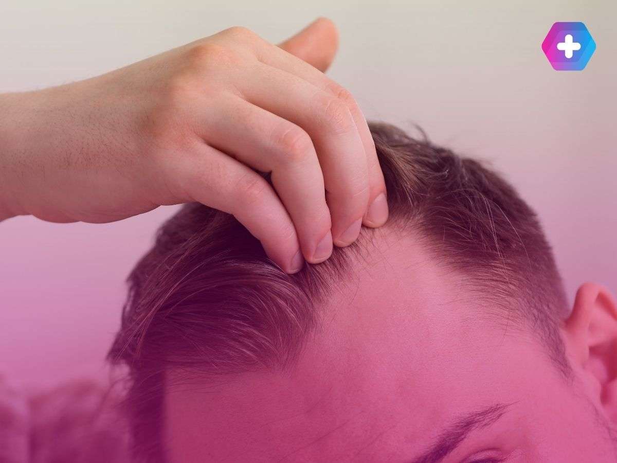 close-up of young man putting his hand through his hair
