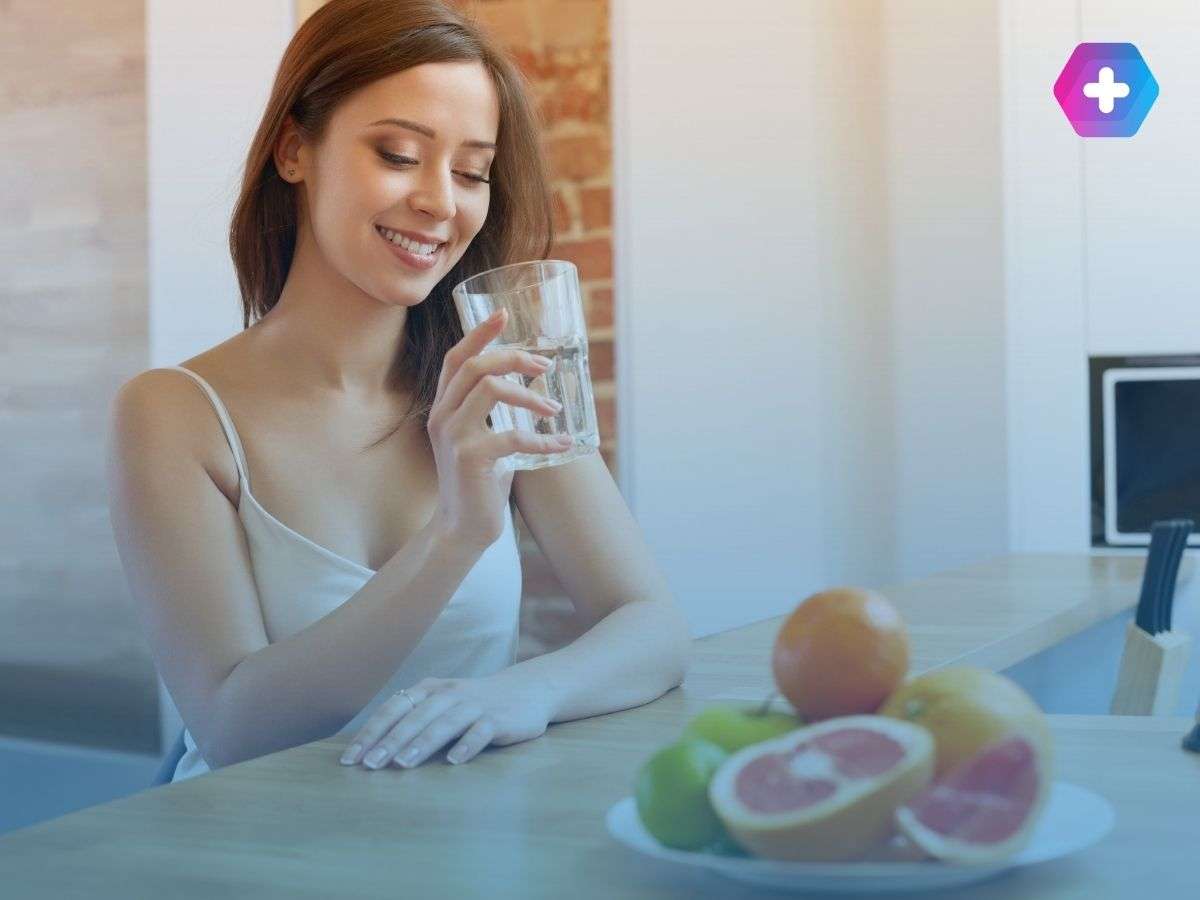 Woman having healthy food and hydrating