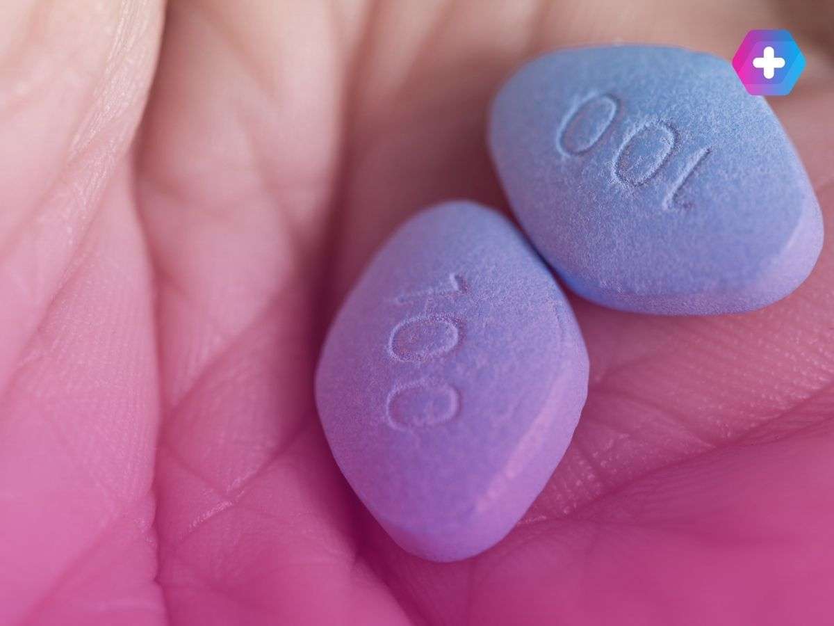 close-up of person holding viagra tablets